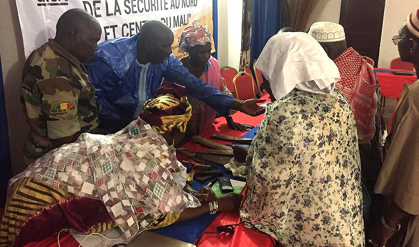 Security forces and civil society members discuss community security issues in Mopti, Mali