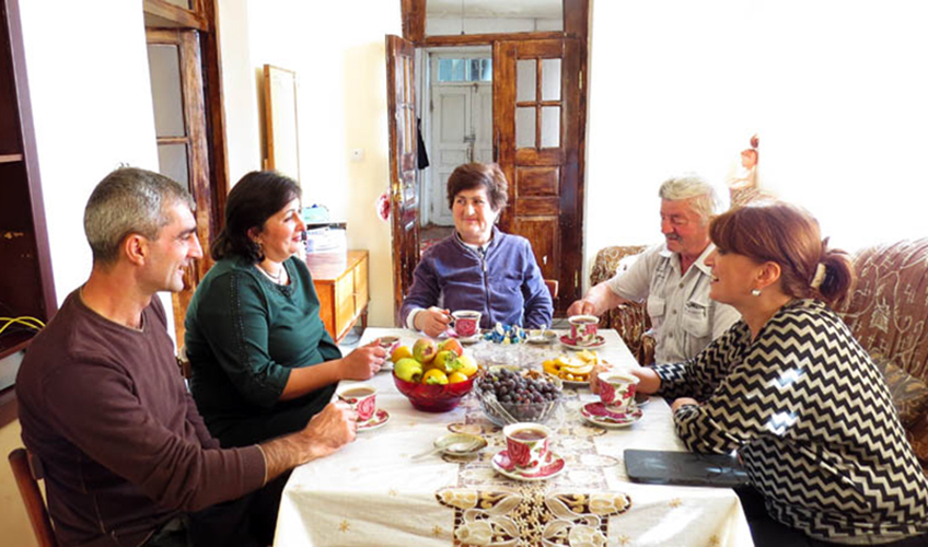 Aida and others sat around the dining table