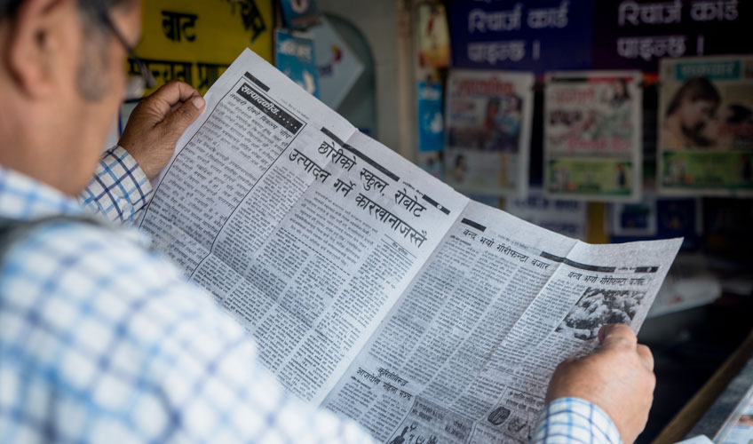 Man reading newspaper