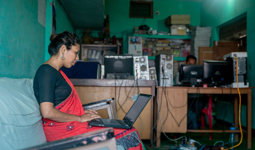 Unnati, a project participant, works in her office.