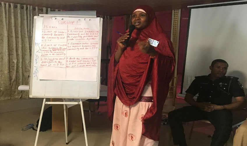 Yakaka advocating for peace and reconciliation in her community.