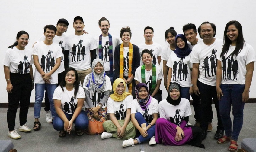 Participants of International Alert’s videomaking workshop pose with Build Up facilitators at their public film screening.