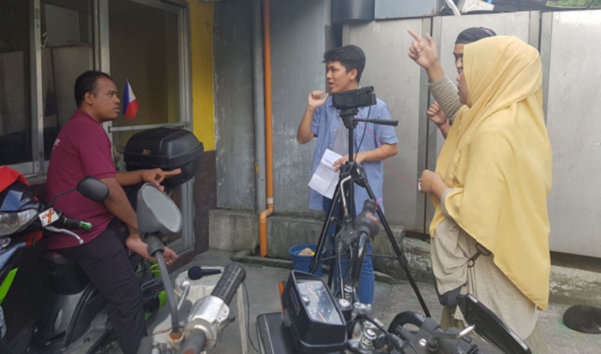 Workshop participants film their documentary in the streets of Metro Manila.