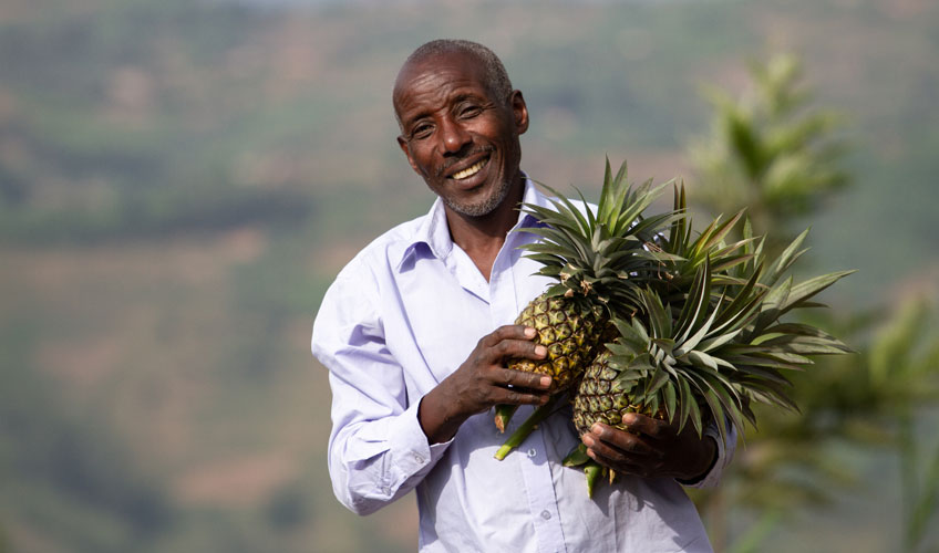 Alexis poses with pineapples