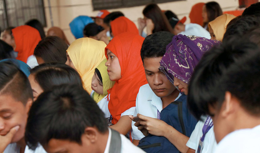 Young people gathered at a meeting.